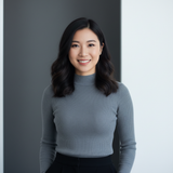 Portrait of a young woman, Alexandra Chen, smiling confidently.