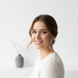 Portrait of Sophie Dubois, a young woman, smiling confidently against a clean white background.